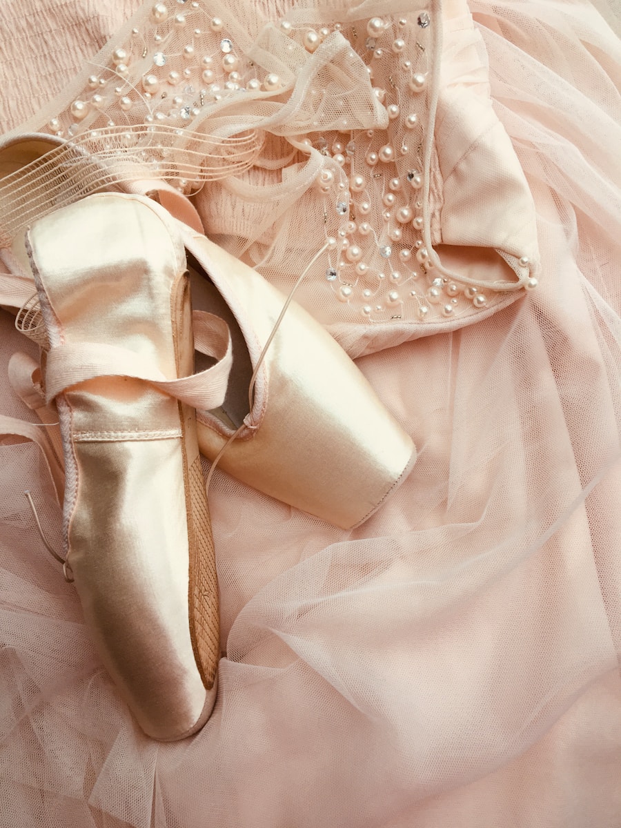 Pointe shoes on soft pink fabric